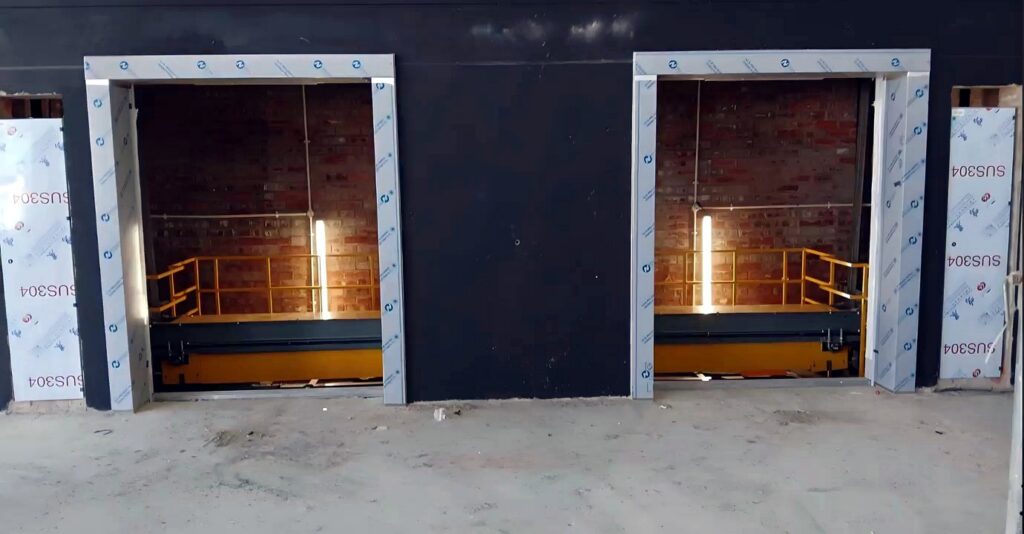 Twin passenger elevator landing openings during the Paarl mall installation.