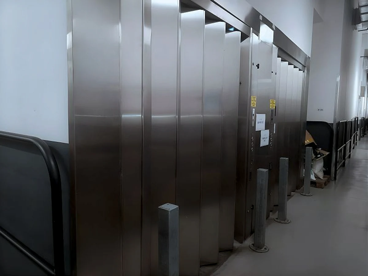 Two stainless-steel goods-hoist entrances documented by Vision Elevators Ltd Mauritius