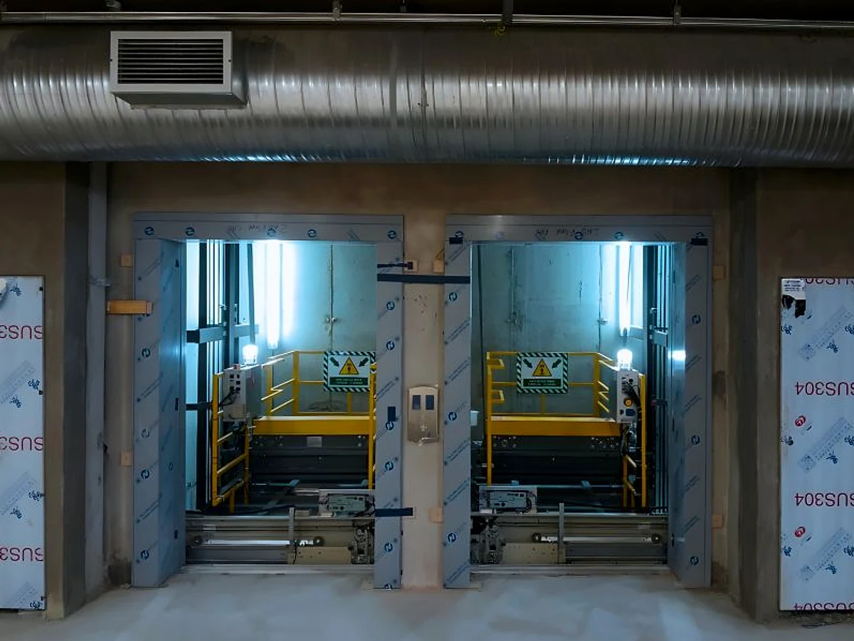 Two passenger-elevator entrances during installation in Sunningdale, Cape Town